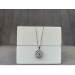 A Beautiful 9ct White Gold Diamond Cluster Pendant on chain. Pendant comprising of approximately .