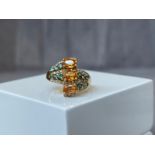 A stunning 14ct Yellow Gold Fancy Set Ring featuring a selection of Citrines, Tourmaline & Diamond