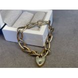A Stunning 9ct elongated twist curb bracelet worn heart padlock- weighing 20.91 grams - 18cm in
