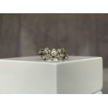 18ct White Gold Fancy Design Diamond Ring with a approximate .15ct centre stone - Weighing 2.78