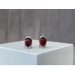 A Pair of 10ct Yellow Gold Garnet & Diamond Stud Earrings - Weighing 2.22 grams