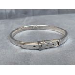 A silver belt style hinged bangle, weighing in at 21.40grams