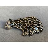A silver plique a jour cat brooch with ruby eyes, weighing in at 7.91grams