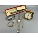 5 various men and ladies watches and side travel clock