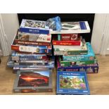 Large lot of puzzles and jigsaws accompanied with board