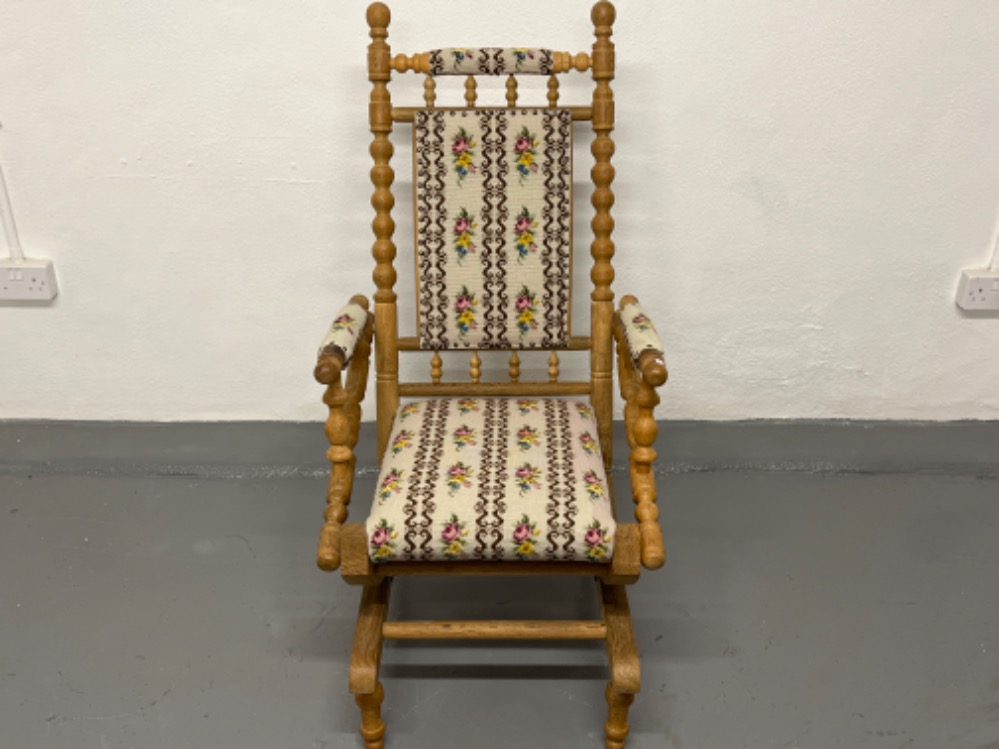Pine rocking chair with embroidered padding