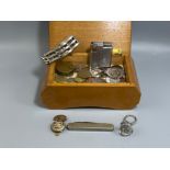 Wooden musical box containing coins and Ronson lighter