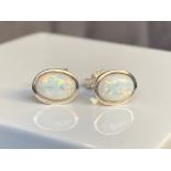 A pair of silver and opal stud earrings, weighing in at 1.2grams