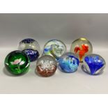 A lot of 7x paper weights all in different styles also has 2x Caithness paperweights