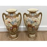 Pair of oriental style twin handled urns - height 40cm