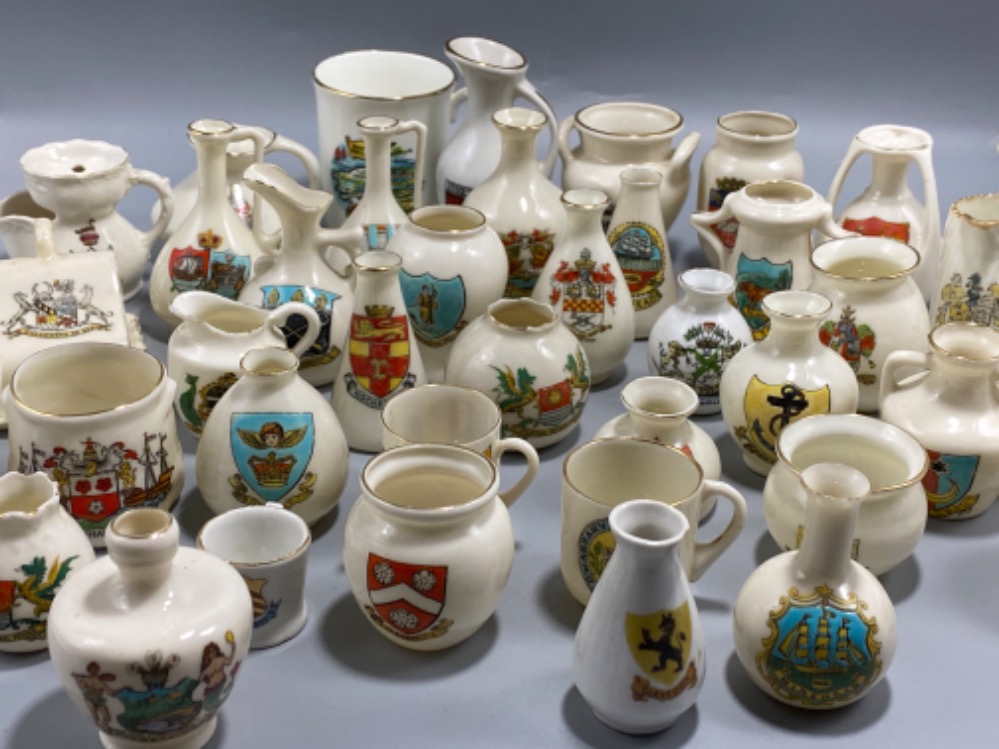 Large lot of 43 miniature porcelain pottery with various stamped crests to include Minehead, Milford