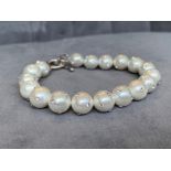 A freshwater pearl bracelet set with CZ’s