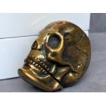 A brass cased skull head vesta