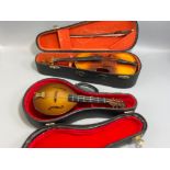 2 miniature cased violin and mandolin