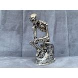 An unusual silver plated skeleton vesta case