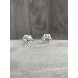 A Pair of Old Cut Diamond Studs Cornet Style set in Platinum. The pair have a combined diamond