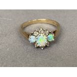 A stunning 18ct Gold Diamond & Opal Ring - Featuring three Opals & six Diamonds - Weighing 1.99