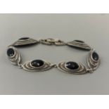 A silver marcasite and agate line bracelet, weight 13.71 grams