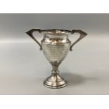 A hallmarked Chester 1937 silver miniature trophy, weight 31.66 grams