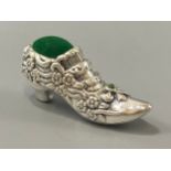 A silver pincushion in the form of a 19th century shoe, weight 20.50 grams