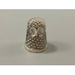 A silver owl-shaped thimble, weight 11.40 grams