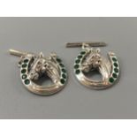 A pair of silver and Emerald horse shoe cufflinks, weight 8.6 grams