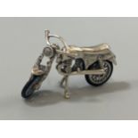 A silver figure of an articulated Norton motorcycle with rubber tyres, weight 13.93 grams