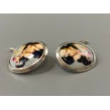 A pair of silver and enamel cufflinks with pin-up semi-nude figures, weight 8.95 grams