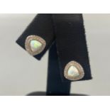 A pair of silver CZ and opal stud earrings, weight 2.84 grams