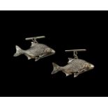 Pair of silver fish style cufflinks, weighing 8.06 grams