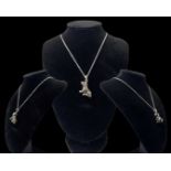 Silver articulate dog pendant on necklace, weighing 10.44 grams