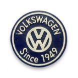 A cast metal Volkswagen Since 1949 sign