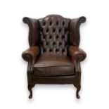 Brown Chesterfield wing back chair