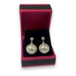 Pair of silver and pearl stud earrings, weighing 6.87 grams