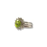 A stunning 14ct White Gold three band design peridot and diamond cluster ring comprising of an