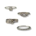 Collection of four silver and CZ rings all of different designs weighing 7.62 grams collectivley