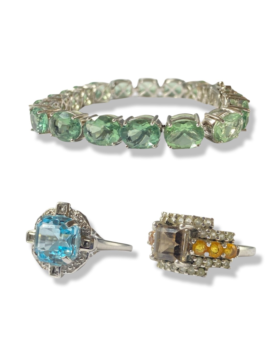 Pair of Silver Gemstone Set Rings alongside a Gemstone Set Tennis Bracelet By TGGC weighing 32.12