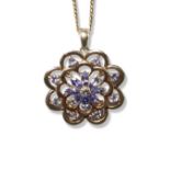 Silver floral design pendant on chain comprising of light purple stones weighing 4.78 grams and 46cm