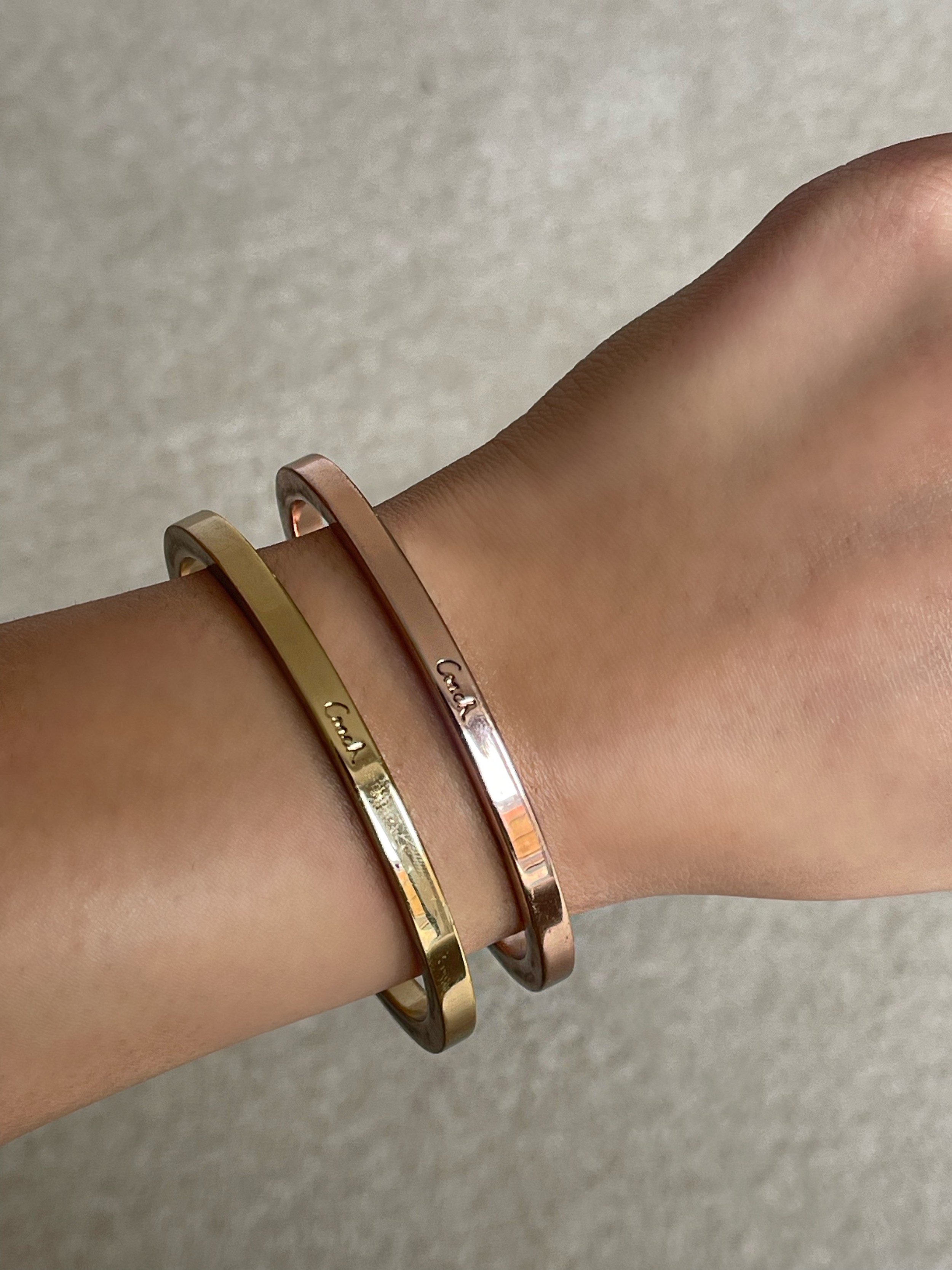 Pair of bangles by Coach, one gold tone and the other rose, weighing 73.3 grams collectively - Image 3 of 3