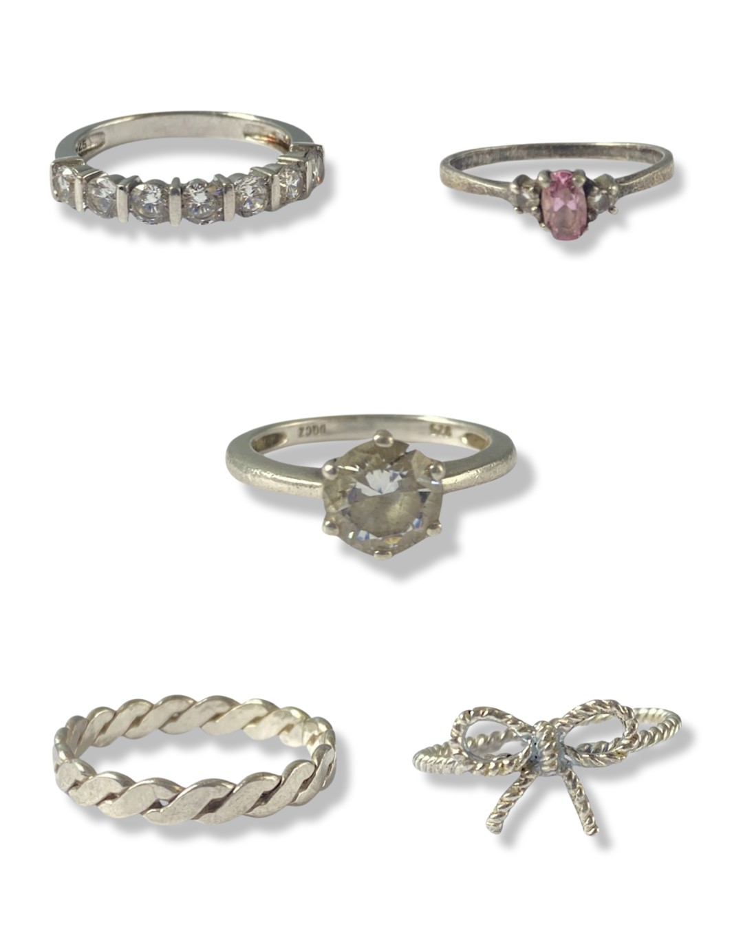 Collection of five silver rings all of different designs weighing 10.18 grams collectively Silver