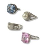 Collection of four silver statement rings all set with different stones and in different styles