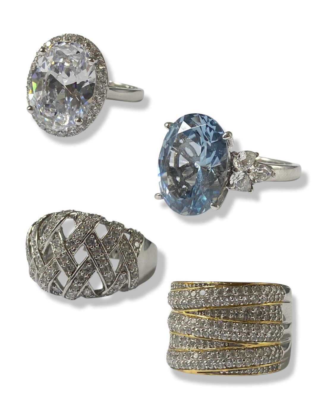 Collection of four boxed silver statement rings all set with different stones and in different