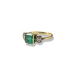 18ct Yellow and white gold emerald and diamond trilogy ring comprising of a square cut emerald