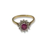 14ct Yellow gold Ruby and Diamond cluster ring featuring an oval pink stone weighing approximately