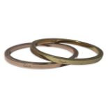 Pair of bangles by Coach, one gold tone and the other rose, weighing 73.3 grams collectively