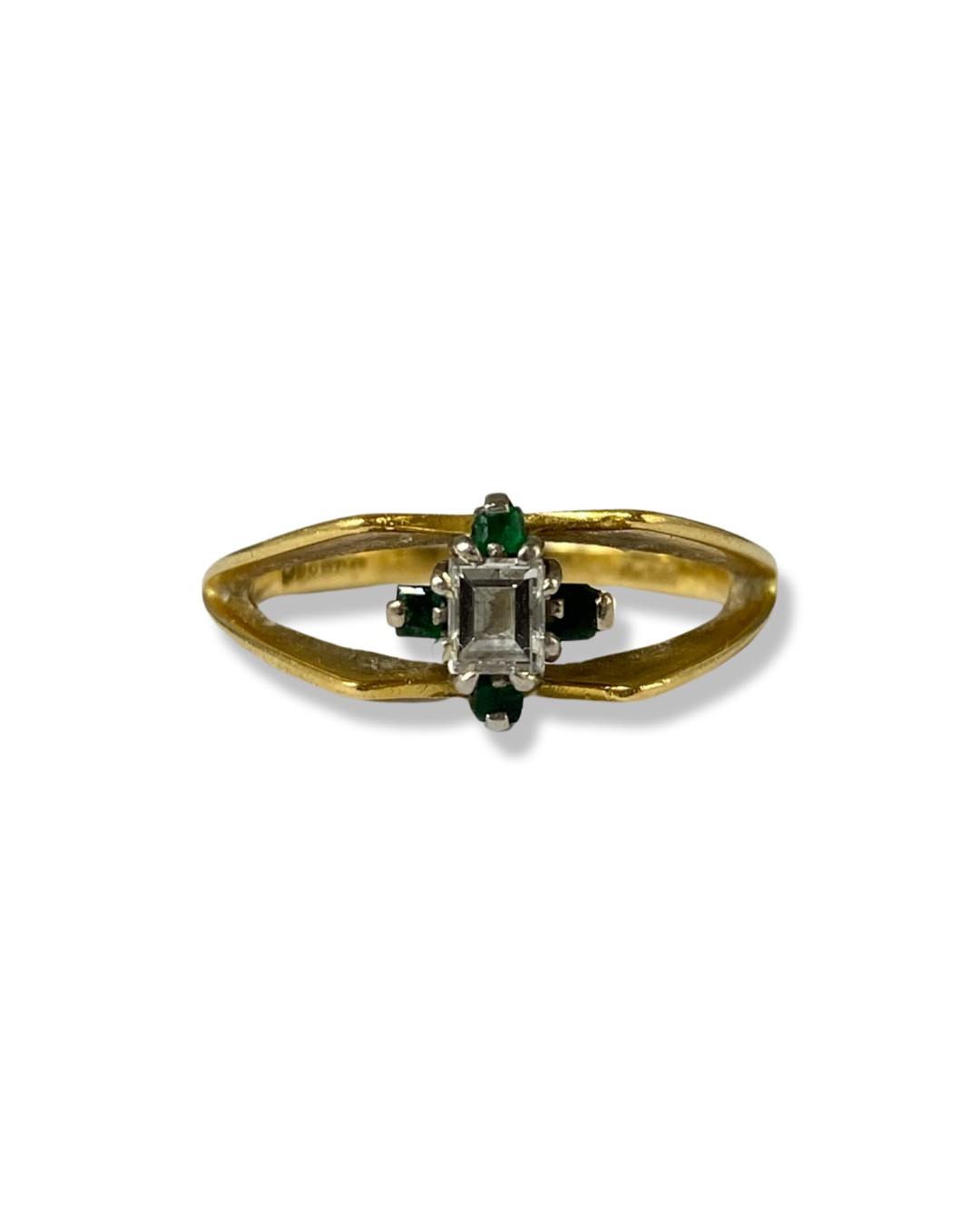 18ct Yellow Gold Fancy Design ring comprising of an Emerald cut Diamond surrounded by four