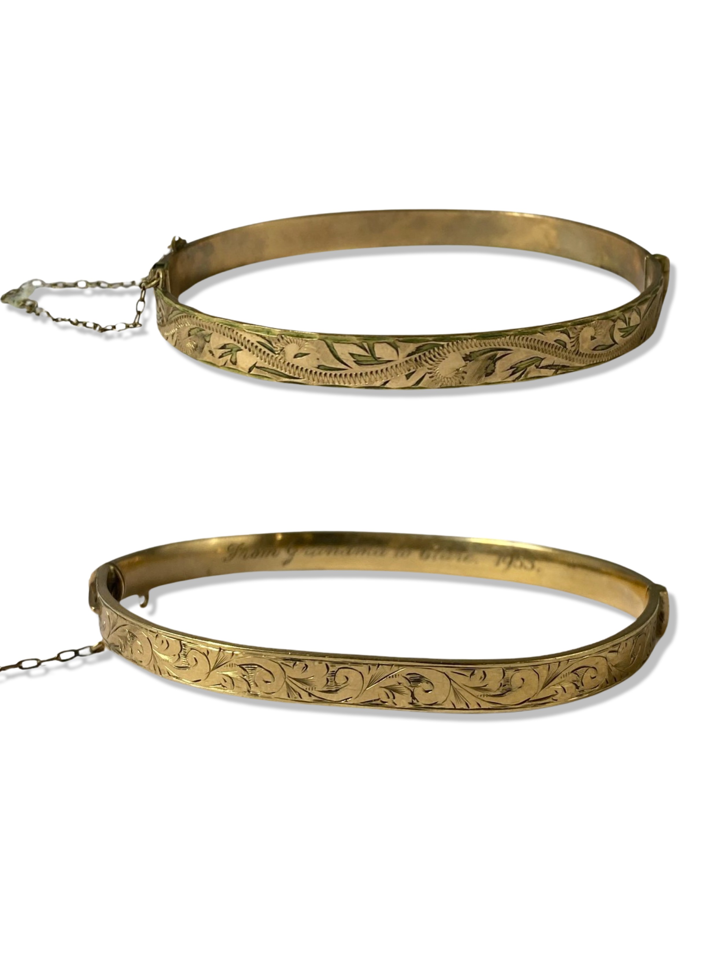 Two 9ct Yellow Gold Bangles with metal cores weighing 21.35 grams collectively