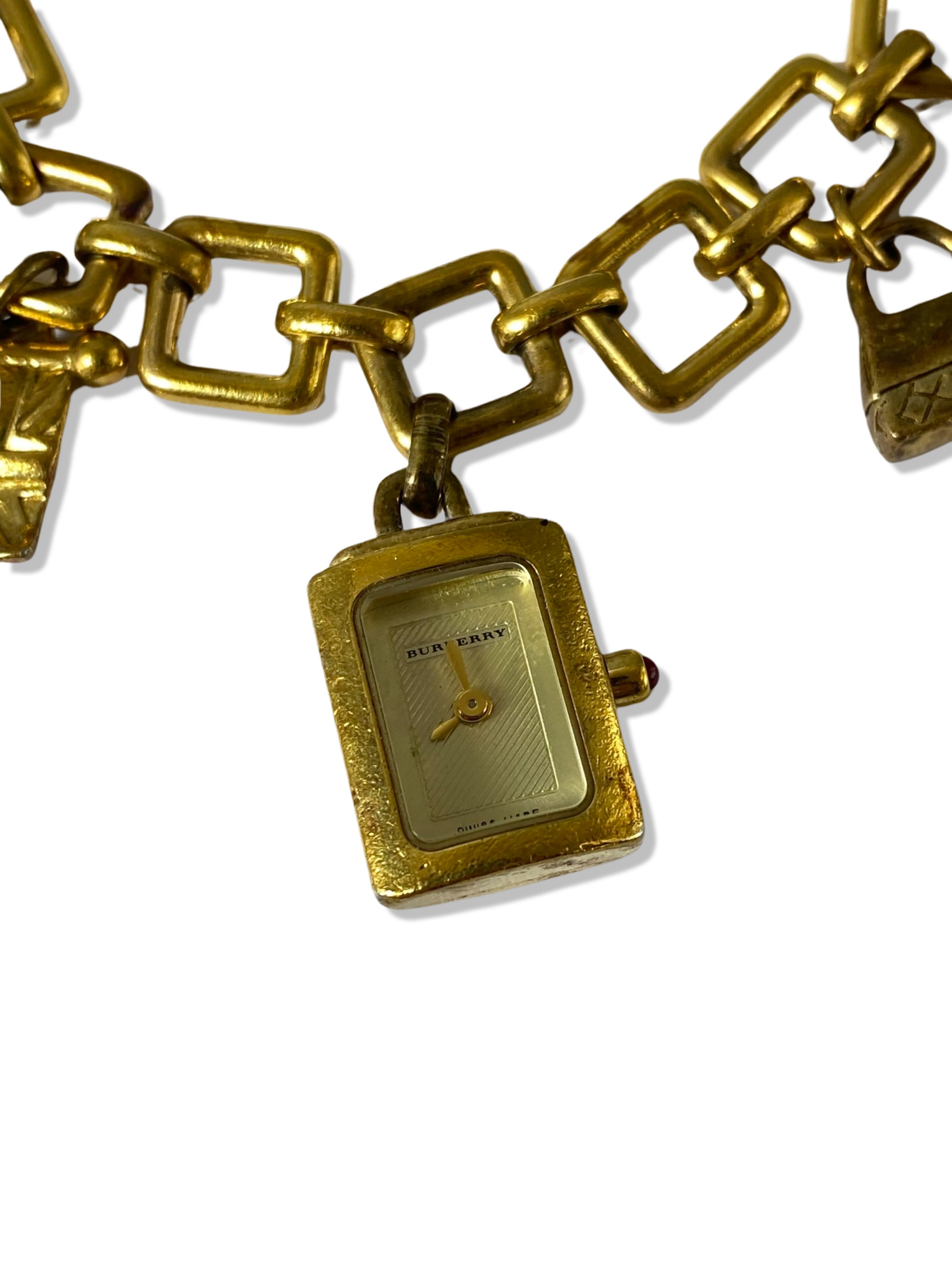 Burberry silver gold tone charm bracelet which includes a working watch charm, weighing 63.03 - Image 2 of 3