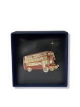 Butler & Wilson gem set red bus brooch still in its seal and box. Dimensions 6cm x 3.5cm