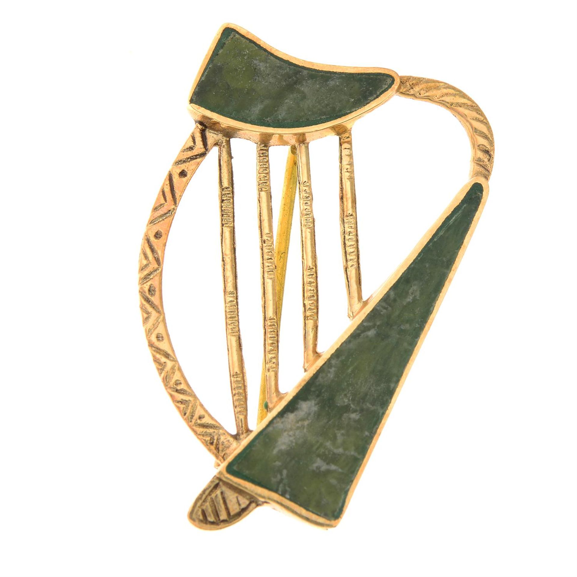 A mid 20th century 9ct gold connemara marble harp brooch.